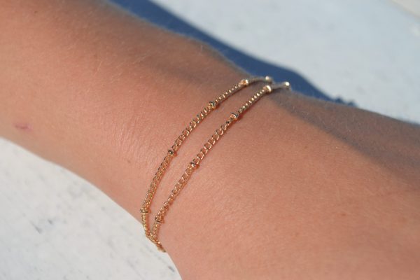 Dubbele gouden armband met balletjes